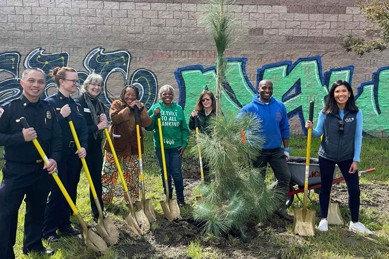 California ReLeaf Arbor Week Volunteers Planting a Tree in Oakland 